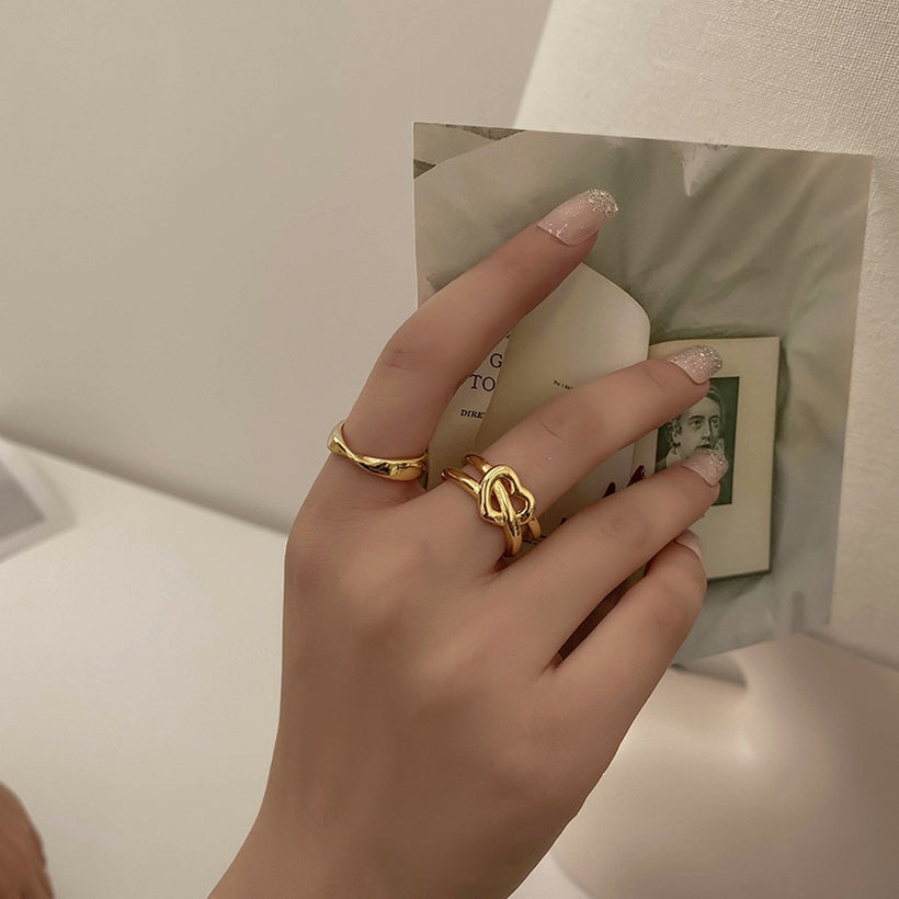 Moda Simple a la moda ahueca hacia fuera el cordón para trenzar el anillo femenino creativo nuevo amor Cruz chica anillo europeo y americano joyería