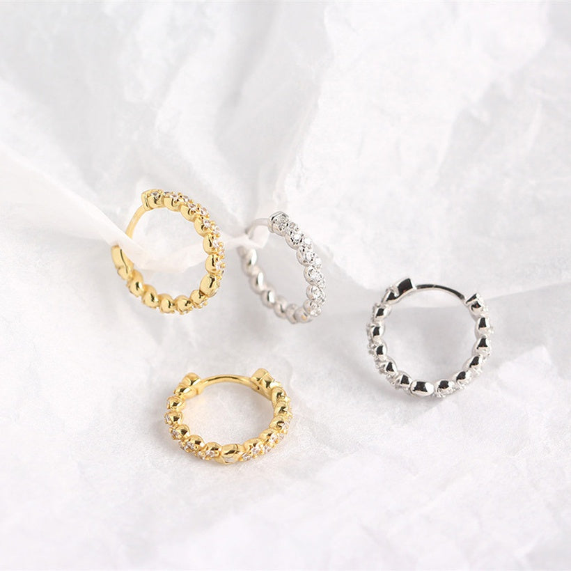 Pendientes de moda con hebilla de oreja salvaje con temperamento de diamante sinuoso y giro geométrico