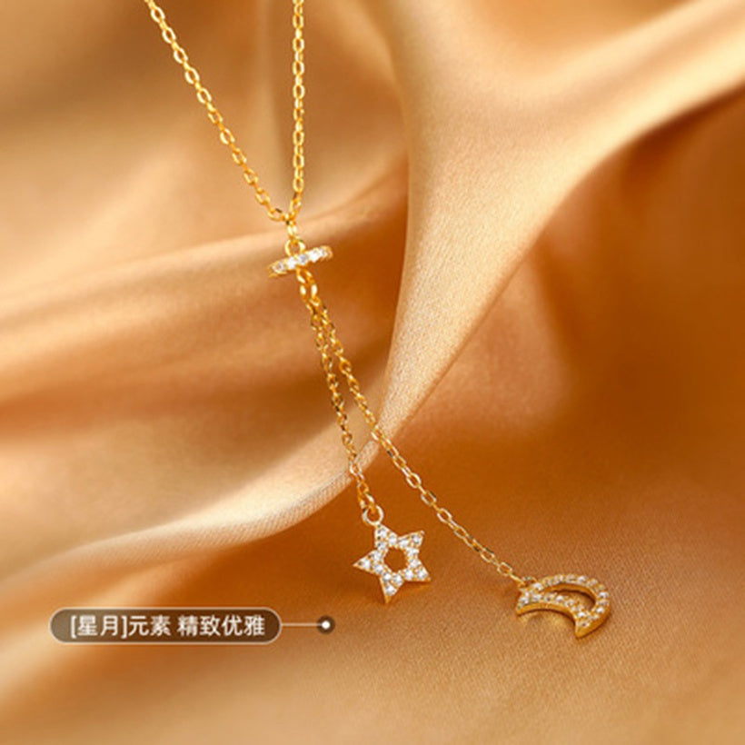 Cadena de clavícula con sentido de diseño de nicho de collar de borla de estrella y luna simple